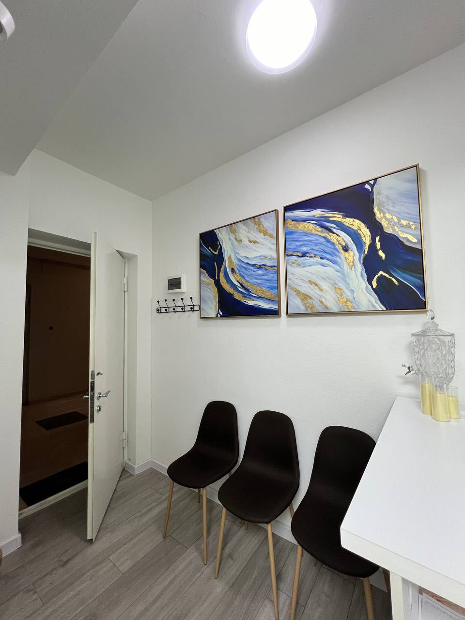 Vake Lasers waiting area with artwork and seating